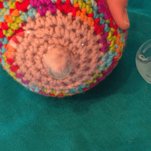 The fitted shield! Your nipple should sit comfortably within the nipple part of the shield. If not, you may need to try a different size or brand