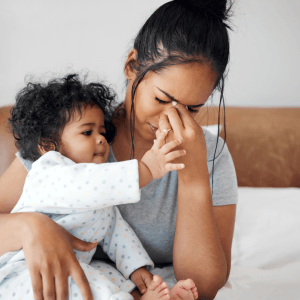 Tired Mum holding baby